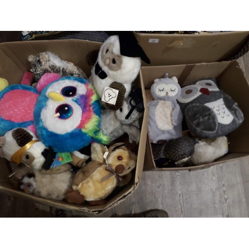 76 - Two boxes of assorted owl soft toys and cushions etc.