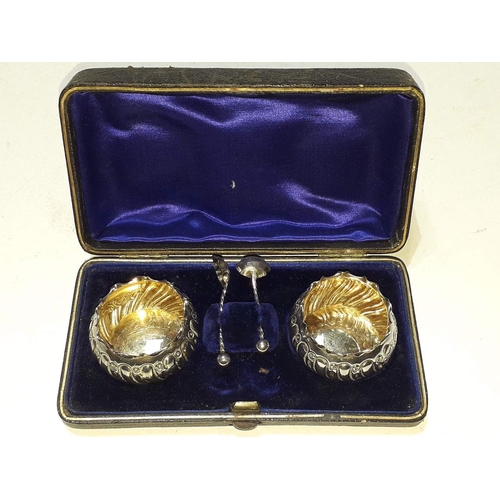 272 - A pair of hallmarked silver cruets with small spoons in original case.