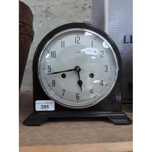 395 - A Smith Enfield bakelite bracket clock with key and pendulum.