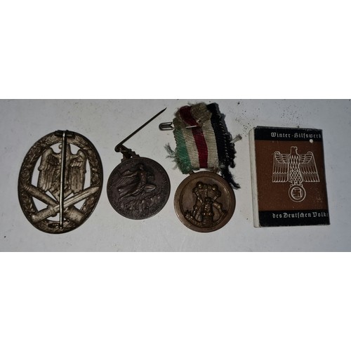 220 - WWII Italian medal pair, Nazi cap badge and miniature book.