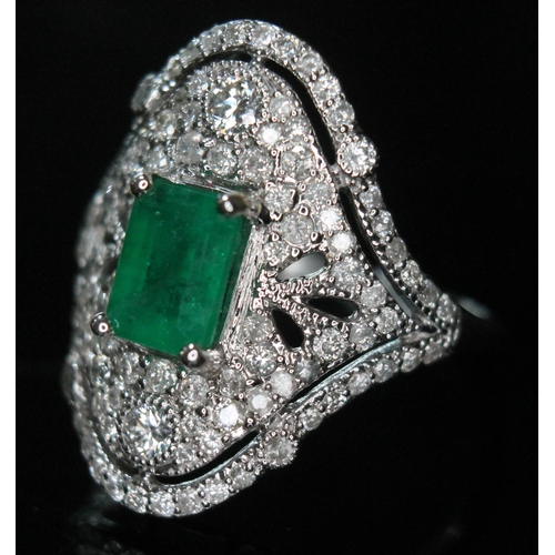 147 - An emerald and diamond ring, the central emerald cut stone weighing approx. 1.04ct, surround by 107 ... 