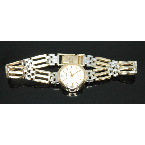 127 - A ladies hallmarked two colour gold Accurist wristwatch with diamond set dial and strap marked '9ct'... 