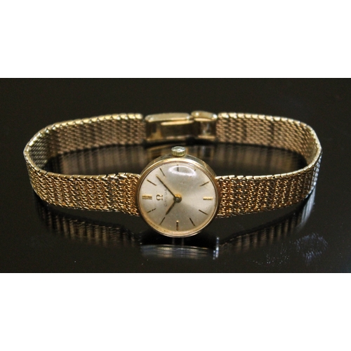 130 - A ladies hallmarked 9ct gold Omega wristwatch, signed champagne dial with gold hour markers and hand... 