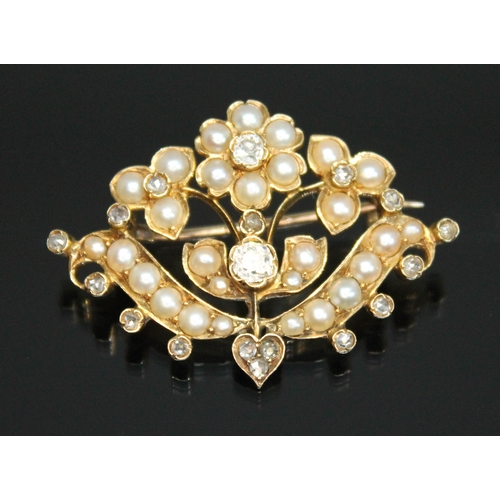 138 - A Victorian split pearl and diamond brooch of floral form, the central Old European cut diamond weig... 