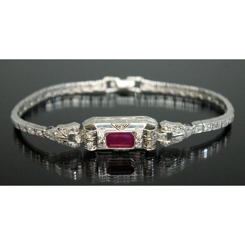 150 - An Art Deco style diamond and ruby bracelet, the emerald cut ruby weighing approx. 4.50 carats, tota... 