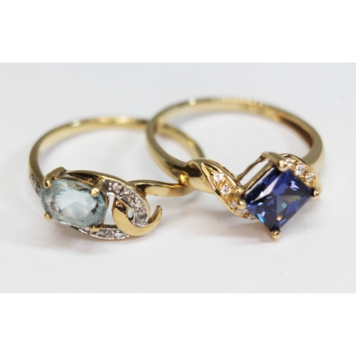 159 - A hallmarked 9ct gold topaz and diamond cluster ring and a another ring set with a violet blue stone... 