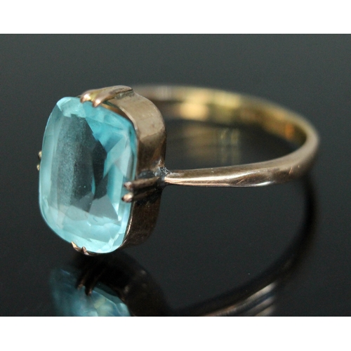 164 - An early 20th century ring set with pale blue paste, marked '18ct', gross weight 3.34g, size Q.