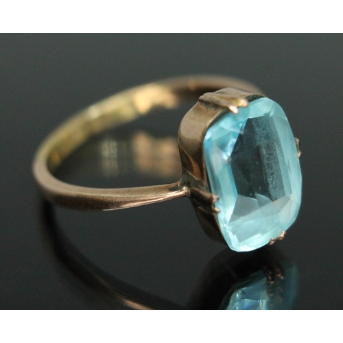 164 - An early 20th century ring set with pale blue paste, marked '18ct', gross weight 3.34g, size Q.