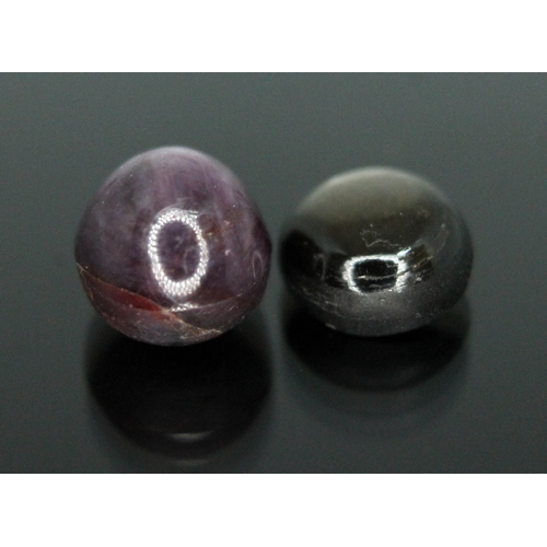 171 - Two corundum variety cabochons displaying six rayed star asterism comprising a star ruby weighing 4.... 