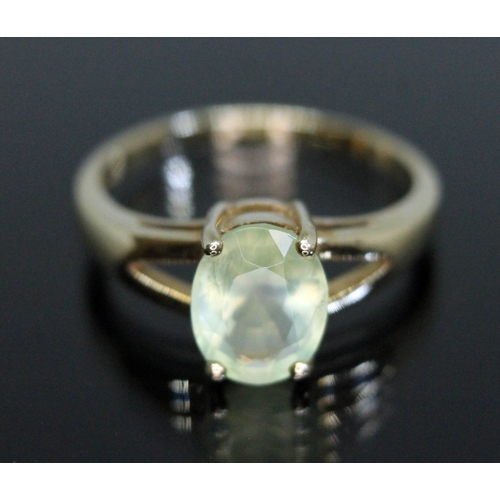 174 - A hallmarked 9ct gold ring set with an oval cut prehnite, gross weight 2.48g, size N.