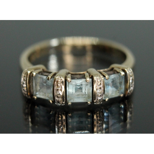 176 - A topaz and diamond baguette ring, hallmarked 9ct gold, gross weight 3.08g, size O/P.