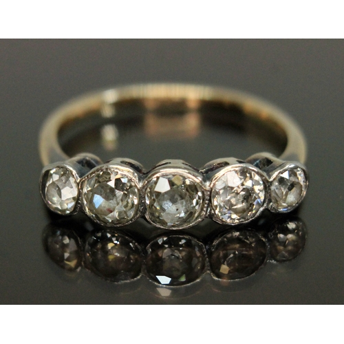 185 - A five stone diamond ring, the bezel set Old European cut stones weighing approx. 0.14, 0.23, 0.21, ... 