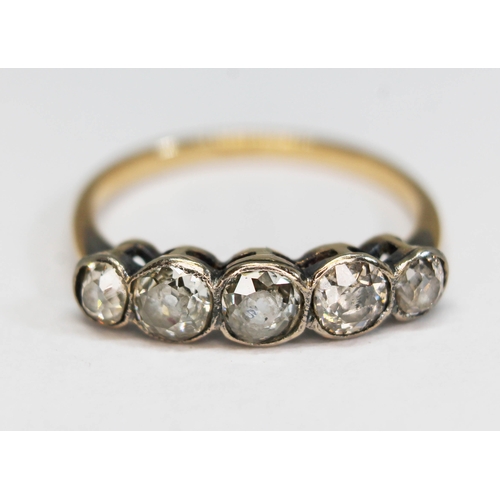 185 - A five stone diamond ring, the bezel set Old European cut stones weighing approx. 0.14, 0.23, 0.21, ... 