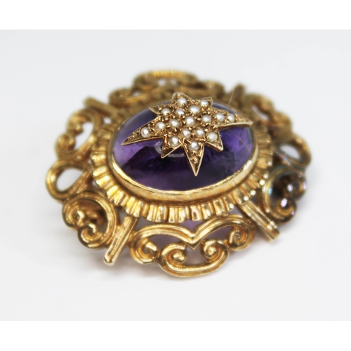 188 - A 9ct gold amethyst and seed pearl brooch, formed as a deep oval amethyst cabochon mounted with a st... 