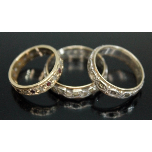 210 - A group of three eternity rings comprising two marked '9ct Sil' and another hallmarked 9ct gold, gro... 