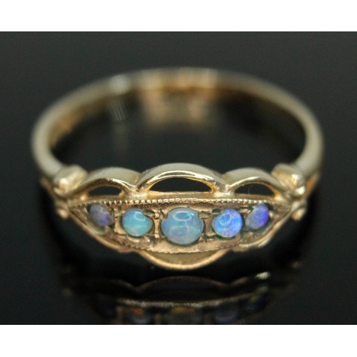 211 - A hallmarked 9ct gold ring set with five moonstones, gross weight 1.91g, size R.