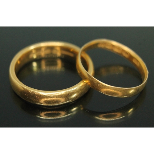 218 - Two hallmarked 22ct gold wedding bands, weight 9.82g, size M & P.