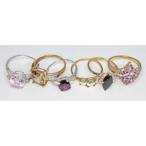 242 - Six assorted hallmarked 9ct gold rings, various stones and settings, gross weight 14.34g, size P.