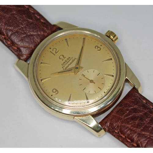 92 - A 1954 Omega Seamaster. ref. 14677088, cal. 491, 33mm gold plated case, signed champagne dial with d... 