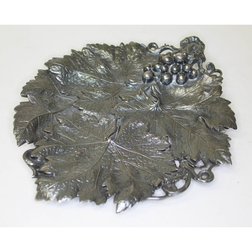 284 - A Victorian silver grape dish, formed as overlapping vine leaves with grape and vine handle, on thre... 