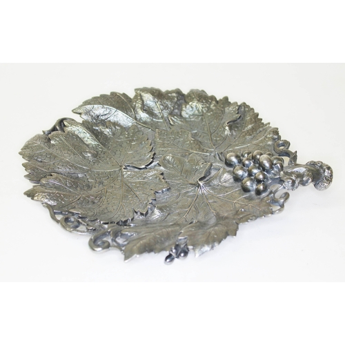 284 - A Victorian silver grape dish, formed as overlapping vine leaves with grape and vine handle, on thre... 