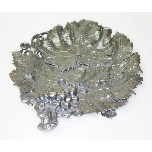 284 - A Victorian silver grape dish, formed as overlapping vine leaves with grape and vine handle, on thre... 