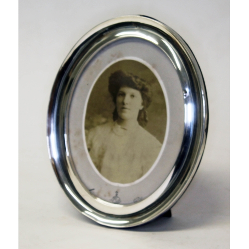 292 - An oval hallmarked silver photograph frame, height 22cm.