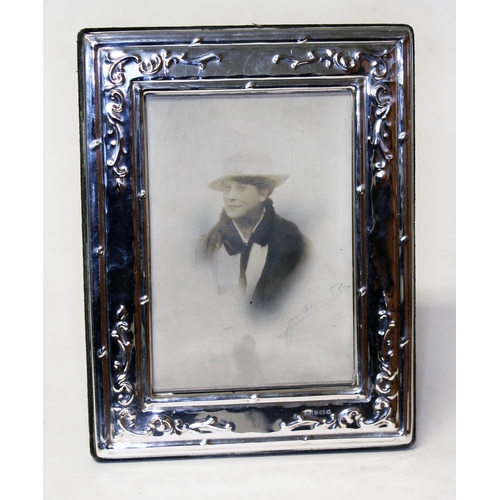 293 - A hallmarked silver photograph frame, height 18cm.