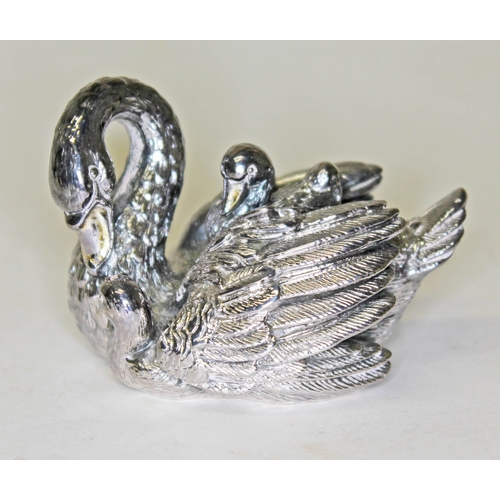 297 - An imported silver filled paperweight modelled as a swan and cygnets, length 7cm.