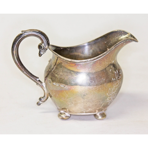 302 - A Victorian hallmarked silver cream jug, length 13cm, weight 4oz.