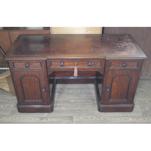 64 - A victorian mahogany pedestal desk with tooled leather top, width 133cm, depth 60cm & height 71cm.