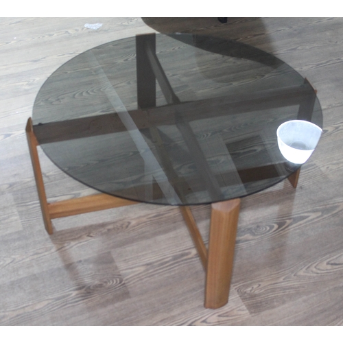 67 - A smoked glass top coffee table. 
Condition- Good overall condition, there are some surface scratche... 