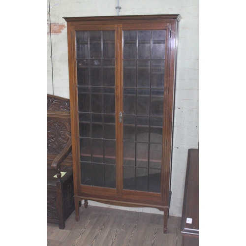 75 - An Edwardian glazed mahogany bookcase, width 91cm, depth 33cm & height 183cm.