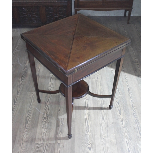 77 - An Edwardian envelope card table, no interior baize lining.