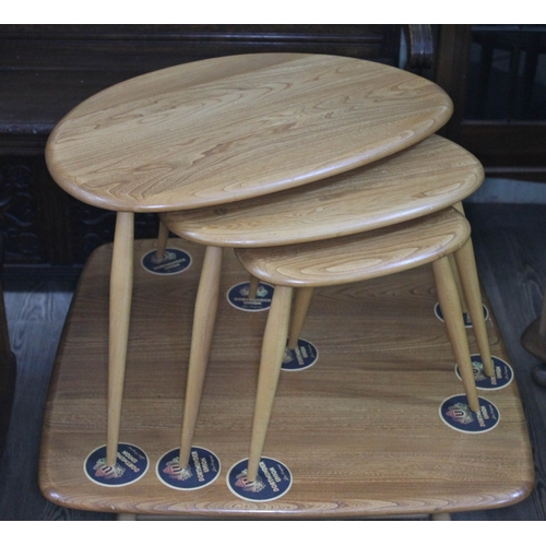 79 - An Ercol Blonde elm and beech Pebble nest of tables.