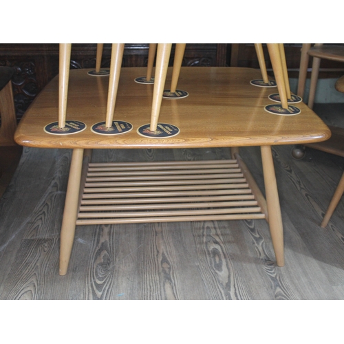 80 - An Ercol Blonde elm and beech square coffee table.