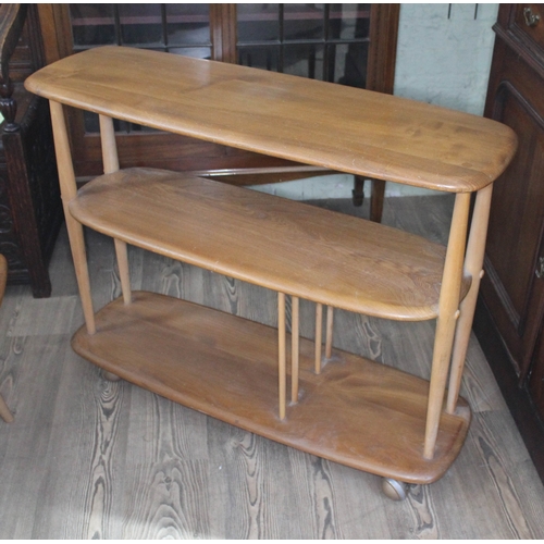 81 - An Ercol Blonde elm and beech open bookcase.