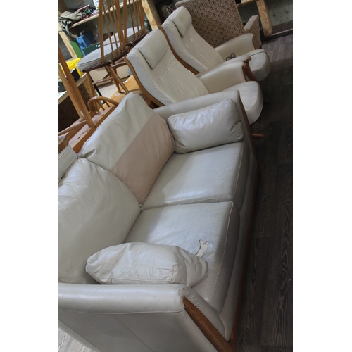 86 - A pair of Ercol cream leather and ash electric reclining lounge chairs and an Ercol cream/grey leath... 