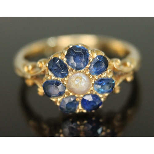 310 - An early 20th century sapphire and pearl cluster ring, the cluster measuring approx. 10.63mm x 11.12... 