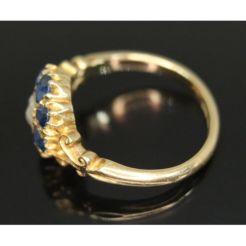 310 - An early 20th century sapphire and pearl cluster ring, the cluster measuring approx. 10.63mm x 11.12... 