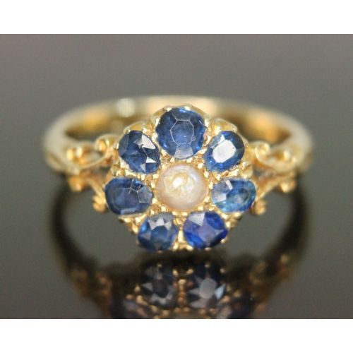 310 - An early 20th century sapphire and pearl cluster ring, the cluster measuring approx. 10.63mm x 11.12... 