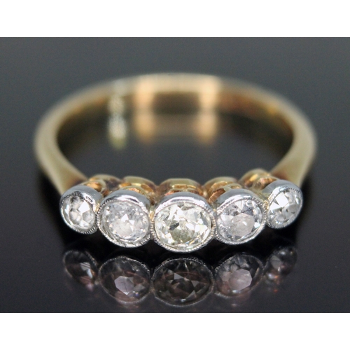 311 - A five stone diamond ring, the millegrain bezel set old European cut stones weighing approx. 0.07, 0... 