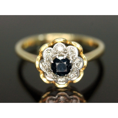 314 - An 18ct gold diamond and sapphire ring, cluster measuring approx. 10.70 in diameter, band marked '18... 