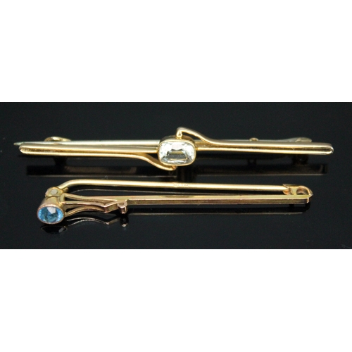 317 - An aquamarine brooch and another bar brooch set with an unidentified blue stone, both marked '9ct', ... 