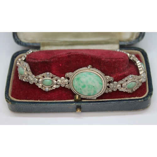 19 - A ladies silver bracelet watch set with mottled green cabochons, marked '925 Sterling Silver'.