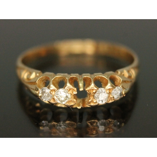 39 - A hallmarked 18ct gold four stone diamond ring, gross weight 1.84g, size H/I.