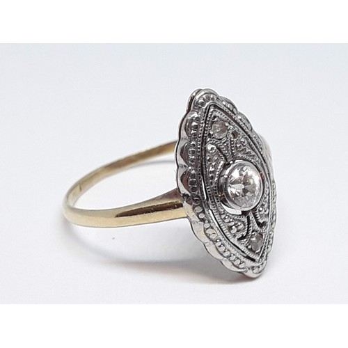 163 - An early 20th century Art Deco style diamond ring, the marquis shaped head set with a central Old Eu... 