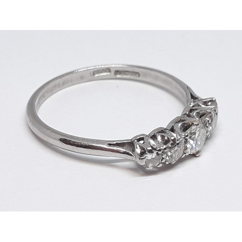 312 - A five stone diamond ring, the round brilliant cut stones weighing approx. 0.07, 0.11, 0.16, 0.10 & ... 