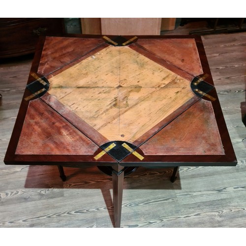 77 - An Edwardian envelope card table, no interior baize lining.