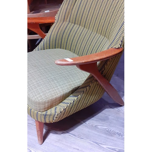 86K - A Swedish armchair with yellow and blue upholstery. 
The chair and the cushion are sprung. The cushi... 